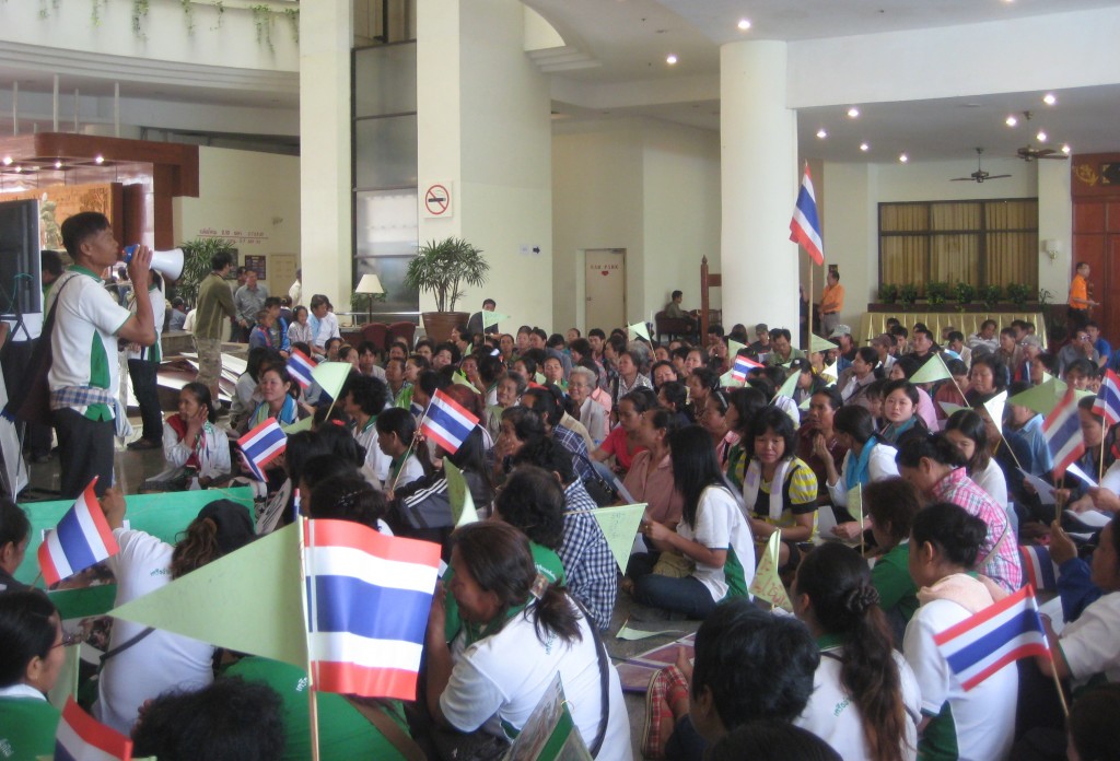 Protesters sit in the lobby of the Loei Palace Hotel in the Muang district to demonstrate against plans of the establishment of a copper mine.