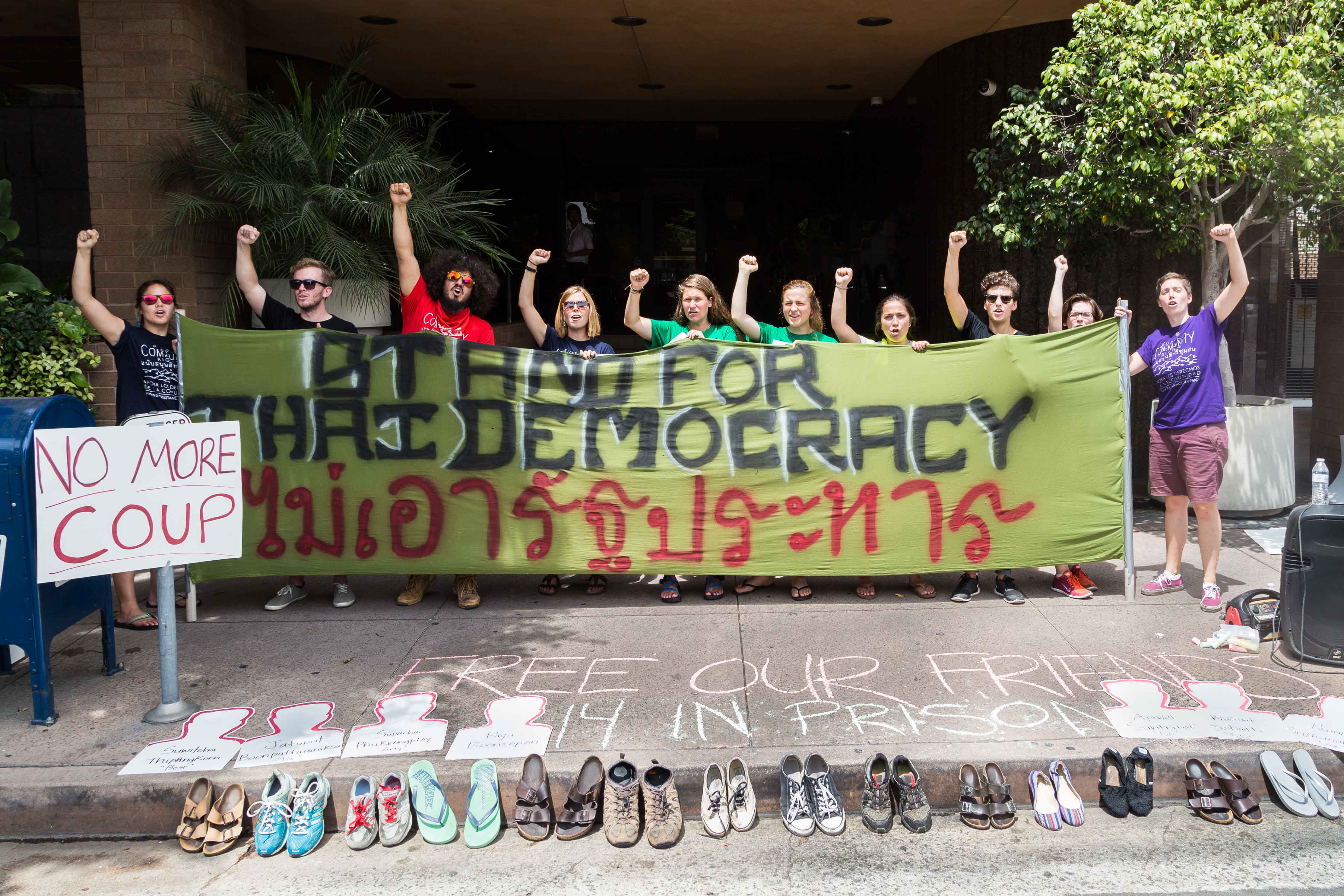 Fourteen pairs of shoes symbolize each student arrested in Bangkok for peaceful protesting. Photo credit: Jeremy Starn